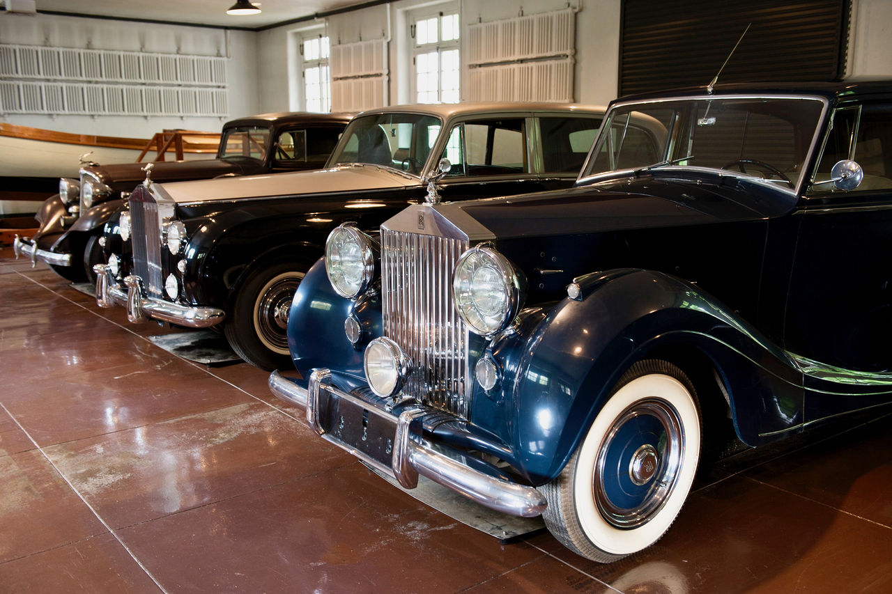 Three of the duPont family's vintage cars are parked next to each other inside the Chauffeur's Garage. 